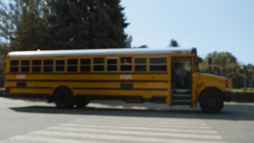 Caring mother escorting son to school bus sunny morning. Young mom watch child boarding schoolbus. Happy woman ruffle curly hair clapping hands with boy. Blonde waiting childrens vehicle leaving. Royalty-Free Stock Footage #1091287081