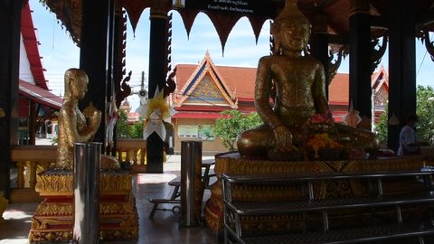 Thai people foreign travelers travel visit and respect praying blessing with holy mystery buddha statue worship of Wat Laksi Rat Samosorn temple at Ban Phaeo on June 8, 2022 in Samut Sakhon, Thailand
