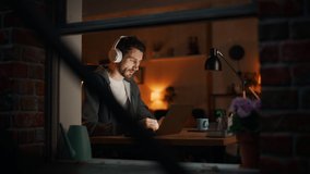 Professional Tireless Software Developer Stretches and Persists Working on Laptop, Writing Code and Working on the Project. Remote Work at Night Time Concept. Static Inside Window Shot Shot - Powered by Shutterstock - Get 15% off with code: PIKWIZARD15