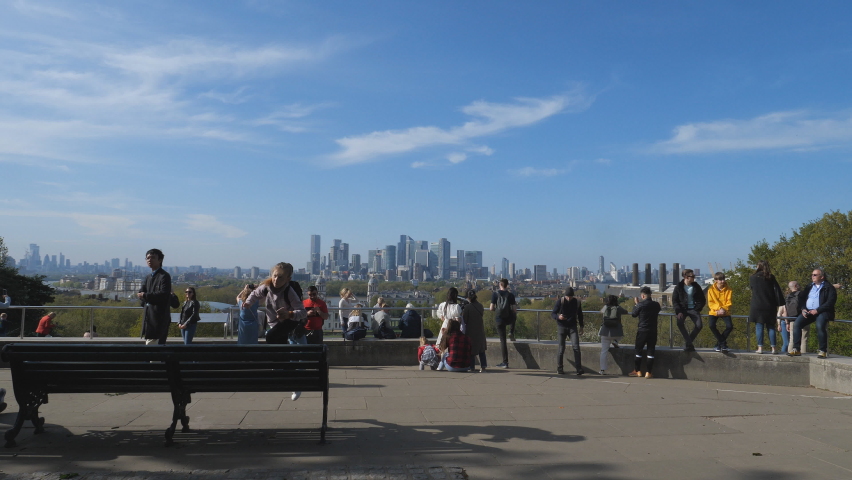 Time lapse. Spectators gather on a hilltop view point in the Greenwich park.
