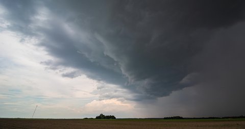 Storm clouds over field, rain over fields, extreme weather, dangerous storm