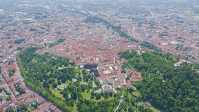 Inscription on video. Graz, Austria. The historic city center aerial view. Mount Schlossberg (Castle Hill). Shimmers in colors purple, Aerial View, Departure of the camera