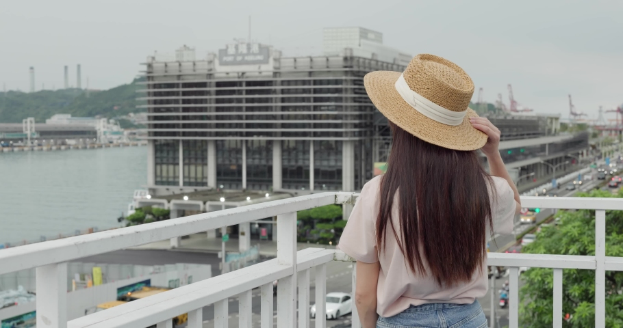 Woman look at the Keelung harbor
