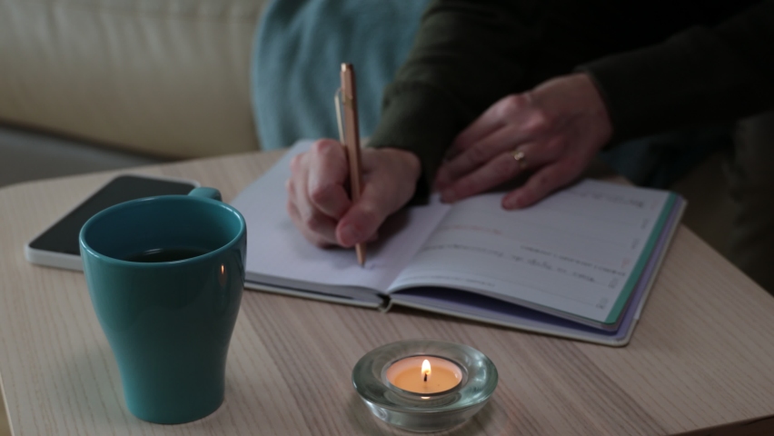 Tea cup and a lighted candle