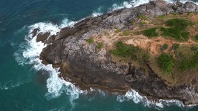 Aerial view of seacoast view in phuket island.Beautiful sea surface Amazing waves seascape mountain view in Phuket Thailand.High quality footage from drone 4K