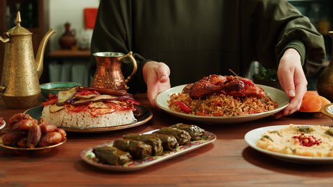 Стоковое видео: Kabsa, maqluba, dolma, tabbouleh close-up, rice and meat dish, middle eastern national traditional food. Muslim family dinner, Ramadan, iftar. Arabian cuisine.