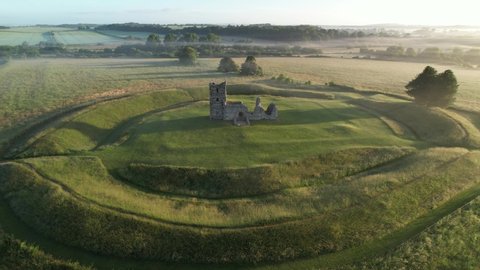 Knowlton Church and Earthworks, Dorset, UK. Sunrise aerial view.