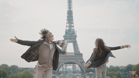 Happy senior couple in Paris. Senior woman and man spending time together at the eiffel tower. Concept about european tourism and landmarks - Powered by Shutterstock - Get 15% off with code: PIKWIZARD15