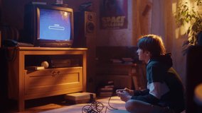 Nostalgic Childhood Concept: Young Boy Playing Old-School Arcade Space Shooter Video Game on a Retro TV Set at Home in His Room with Period-Correct Interior. Successful Kid Passes the Level and Wins.