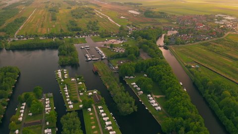 Aerial View Of Rural Dutch Landscape With Green Fields, Houses, Boats, And Polders In Waterstaete Ossenzijl, Netherlands. - Aerial Shot