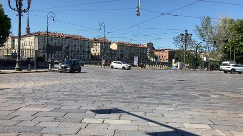 Turin (Torino), Italy - June 10, 2022: Public Transportation Bus GTT, Gruppo Torinese Trasporti (turin Transport Group), transits in Piazza Gran Madre on paved pavement in summer, tracking pano motion