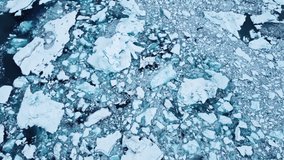 Arctic nature landscape in Unesco World Heritage Site, World of ice, Drone aerial top view video in 4k, Climate Change and Global Warming, Icebergs from glacier in Jokulsarlon lagoon in Iceland, 