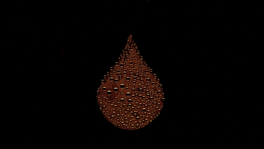 Drop shape printed on the wet glass with orange drops blown off with air stream on black background | hydrating concept