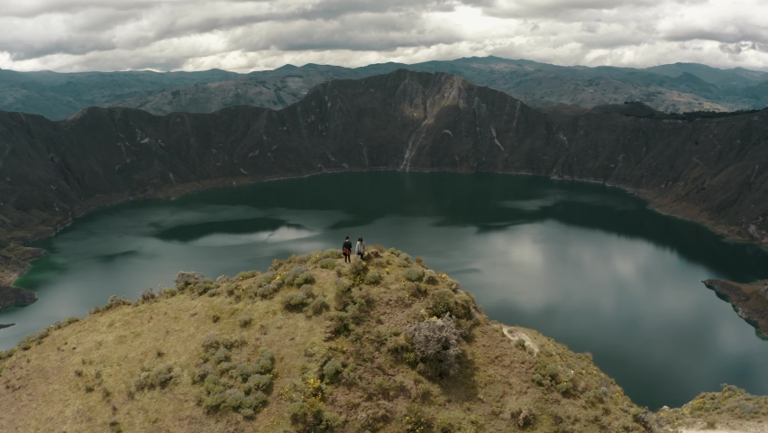 Quilotoa Lagoon In Ecuadorian Andes Volcano On A Cloudy Day - aerial orbit Royalty-Free Stock Footage #1091345049