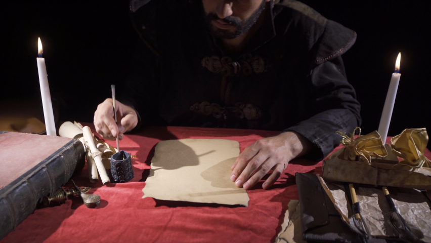 Historical English Alphabet.
Medieval man writing letters using the English alphabet.
