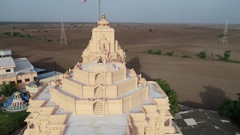 Palitana , Gujarat , India - 06 13 2022: Jain temples on top of Shatrunjaya hill. Palitana (Bhavnagar district), Gujarat, India. Aerial forward shot of jain mandir above the palitana mountain.