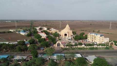 Palitana , Gujarat , India - 06 13 2022: Aerial shot of 900 temples situated in the Gujrat city of India. Jain temples on top of Shatrunjaya hill. Palitana (Bhavnagar district), Gujarat, India