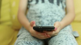 Little Child daughter use smartphone in home leisure time,kids education technology addiction