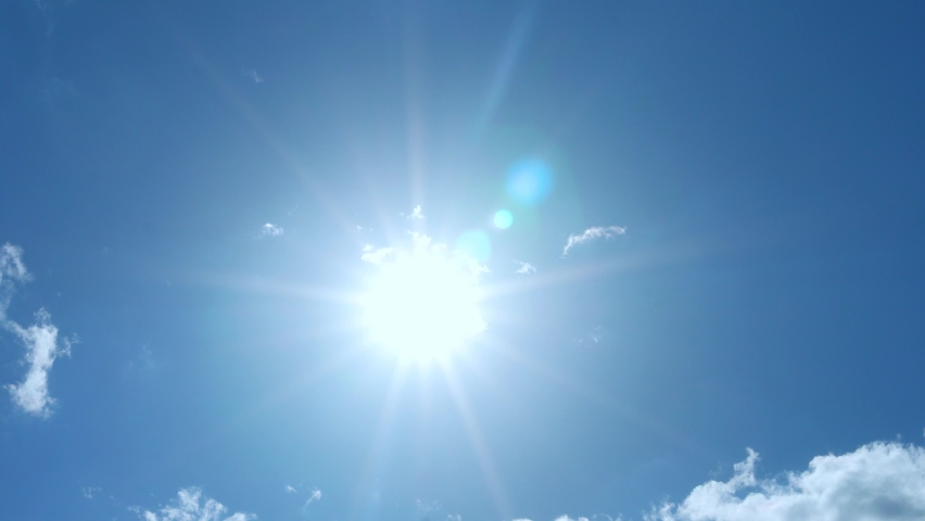 Sun in Clear Blue Sky and Slightly Cloudy, Time Lapse, Slow Motion. Sunny Summer Sky Glowing Sun Sunlight, Glare, Rays, Sunshine. Clear Blue Skyscraper with Sun in Good Clear Weather | Shutterstock HD Video #1091364701