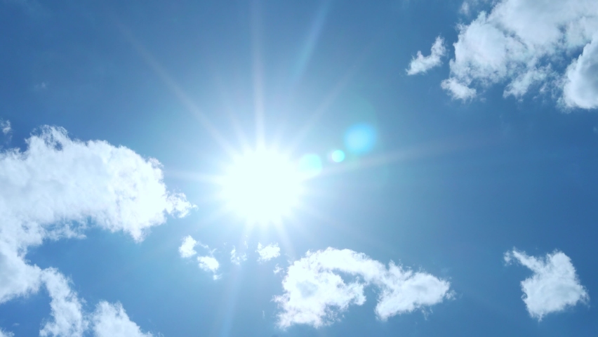 Sun in Clear Blue Sky and Slightly Cloudy, Time Lapse, Slow Motion. Sunny Summer Sky Glowing Sun Sunlight, Glare, Rays, Sunshine. Clear Blue Skyscraper with Sun in Good Clear Weather | Shutterstock HD Video #1091364701