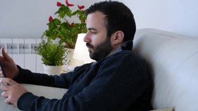 businessman boring with his tablet in home	
