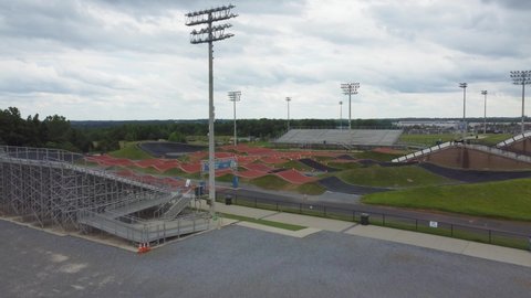 Rock Hill, South Carolina, USA - June 3, 2022: Aerial push over new BMX track in Riverwalk community.