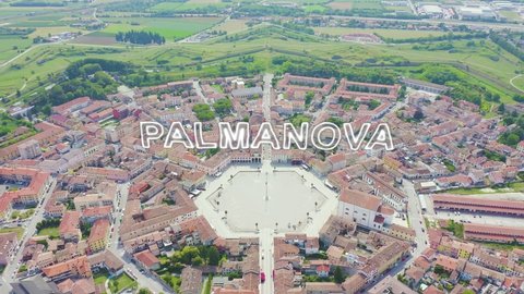 Inscription on video. Palmanova, Udine, Italy. An exemplary fortification project of its time was laid down in 1593. Neon white effect text, Aerial View