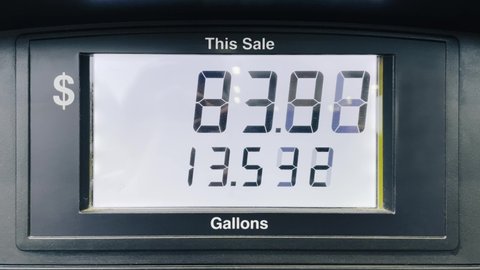 Fuel gas increased cost due to economy inflation. Gas station fuel meter counter price. Close up car refueling by increasing petrol costs. Digital counter count up, gas pump, rising gas prices in USA