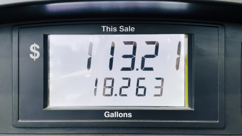 Increasing petrol costs in US dollars. Gasoline price counter on display showing gas price, gas pump meter running at gas station. Gas station fuel meter counter price. Close up while refueling a car Royalty-Free Stock Footage #1091368897