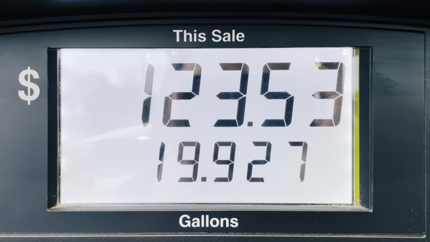 Increasing petrol costs in US dollars. Gasoline price counter on display showing gas price, gas pump meter running at gas station. Gas station fuel meter counter price. Close up while refueling a car | Shutterstock HD Video #1091368897