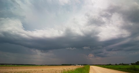 Storm clouds over field, rain over fields, extreme weather, dangerous storm