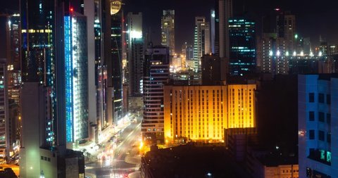 Kuwait City, Kuwait - June 6 2022: Kuwait City Day to Night Time lapse, Daybreak on Crossroad of Fahad Al Salem Street and Abdulaziz Hamad Al Saqer Street