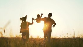Happy family in park. People walk in nature on green grass. Family run through green meadow. Child walk on grass. Healthy lifestyle of people. Green meadow in park. Family father mother and child run - Powered by Shutterstock - Get 15% off with code: PIKWIZARD15