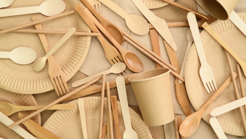  Disposable paper plates, cups and wooden cutlery, top view, rotating | Shutterstock HD Video #1091385015