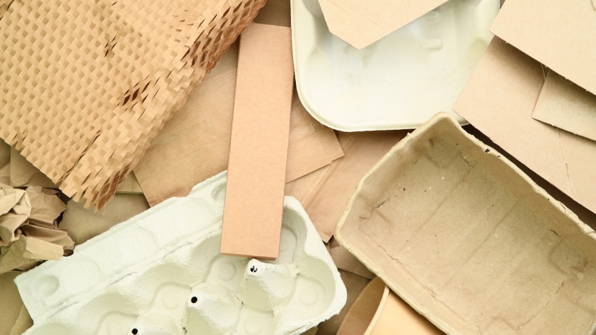 Brown paper cups, boxes, packaging and other paper waste prepared for recycling, top view	 | Shutterstock HD Video #1091385259