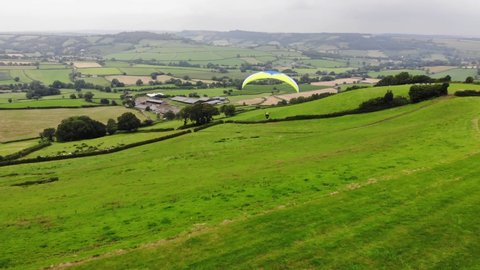 Aerial shot of a Paraglider just taken off from a hill in England