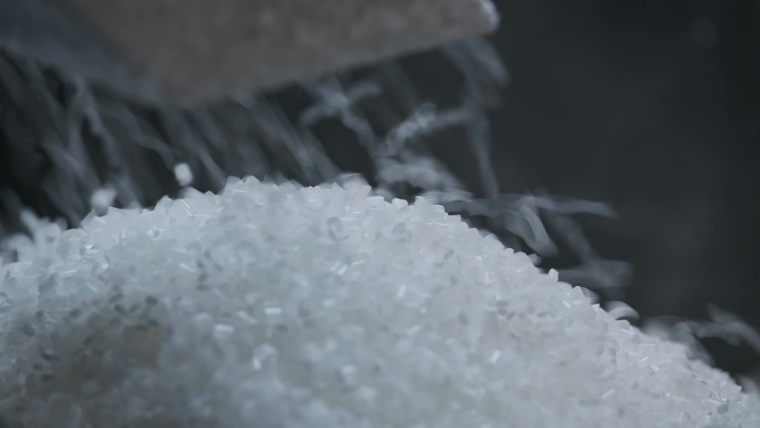 Polyethylene granules. Plastic resin. White plastic pellets. Raw material for plastic products. Grains pouring in a heap. Coloring concentrates and additives for plastics | Shutterstock HD Video #1091392401