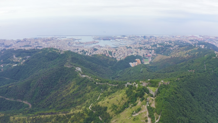 Inscription on video. Genoa, Italy. Forte Sperone is a key point of the 19th-century Genoese fortifications and is located on top of the Mura Nuove. View of Genoa. On the mechanical display, Aerial V