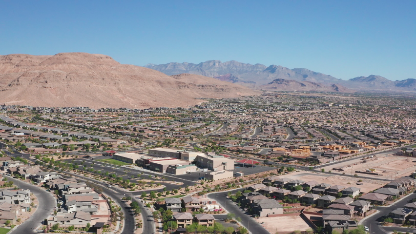 Aerial scenic view of Las Vegas houses, water park, schools with Red Rock view | Shutterstock HD Video #1091396453
