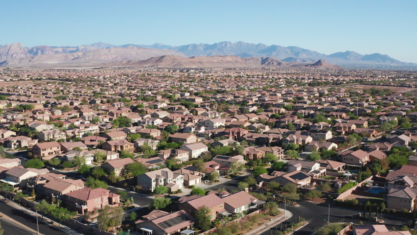 Aerial shot of Las Vegas suburban residential neighborhood and mountain view | Shutterstock HD Video #1091396461