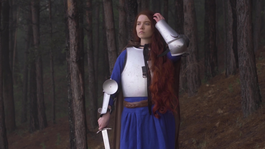 Young red-haired girl in medieval knight
