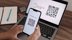 Log In Web Page Using Smartphone with QR Code Scanning Application. Authorization or Autentification with Bar Code Reader. Synchronously Successful Approval on Laptop and Mobile Phone. CloseUp VIew.  - Powered by Shutterstock - Get 15% off with code: PIKWIZARD15