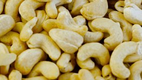 Raw cashew nuts top view rotation. Healthy Food. 4K UHD video, slow motion shot
