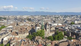 Inscription on video. Geneva, Switzerland. Flight over the city. Geneva Cathedral. Multicolored text appears and disappears, Aerial View, Point of interest