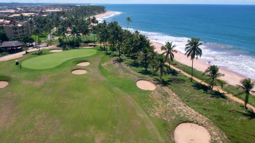Praia do Forte - Mata de São João Salvador Bahia with a golf course next to it. A beautiful beach, very well cared for by a resort, offers a lot of attraction for all types of audiences,