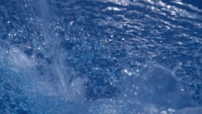 Air Bubbles in the Blue Water.Many bubbles in pool water close up, abstract water.4k video.