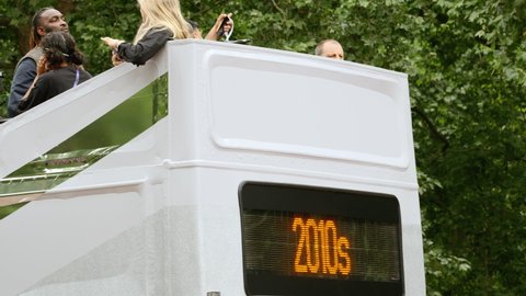 LONDON, circa 2022 - A 2010s evocative bus celebrating British traditions travels down the Mall, on the occasion of the QUEEN PLATINUM JUBILEE
