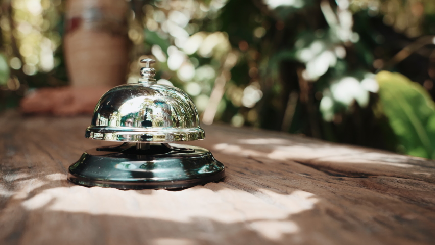 Hospitality hotel. Customer hand ringing service bell at coffee cafe shop for calling the staff to receive the menu, Woman finger touching to ring bell Royalty-Free Stock Footage #1091428917