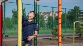 teenage boy trains on a sports ground outdoors, he does physical exercises, a healthy lifestyle, a bright sunny day in summer

 - Powered by Shutterstock - Get 15% off with code: PIKWIZARD15