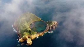 Azores. Drone flying over Vila Franca do Campo volcanic island in atlantic ocean, San Miguel, Azores, Portugal. Overhead shot of volcanic islet washing by atlantic ocean water, 4k footage